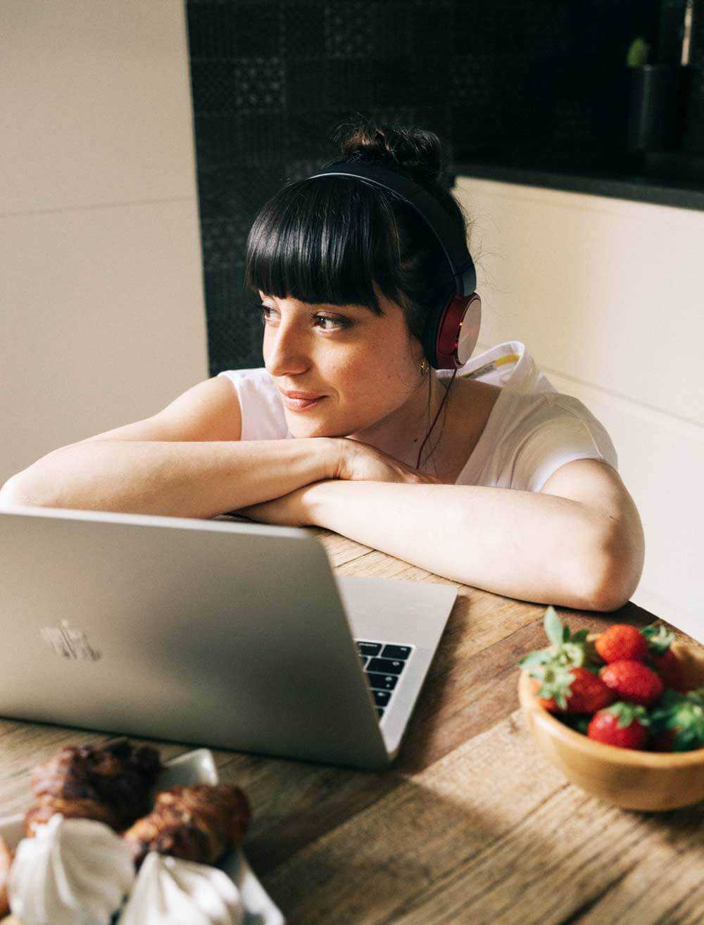 Woman at home relaxing with her laptop
